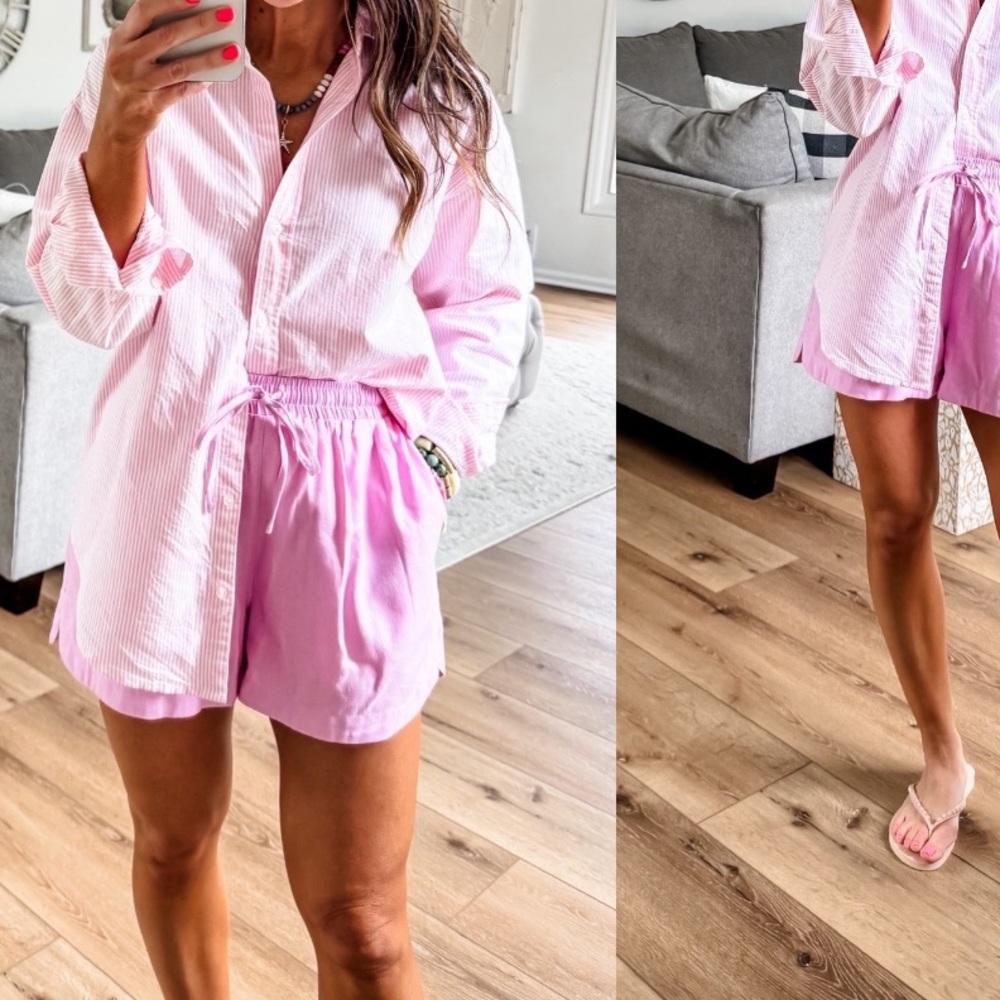 Lined Pink smocked pull on shorts with tie front & pockets.